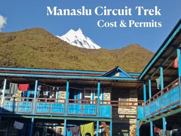 Snow-capped peaks of the Manaslu region with rugged trails winding through alpine terrain.