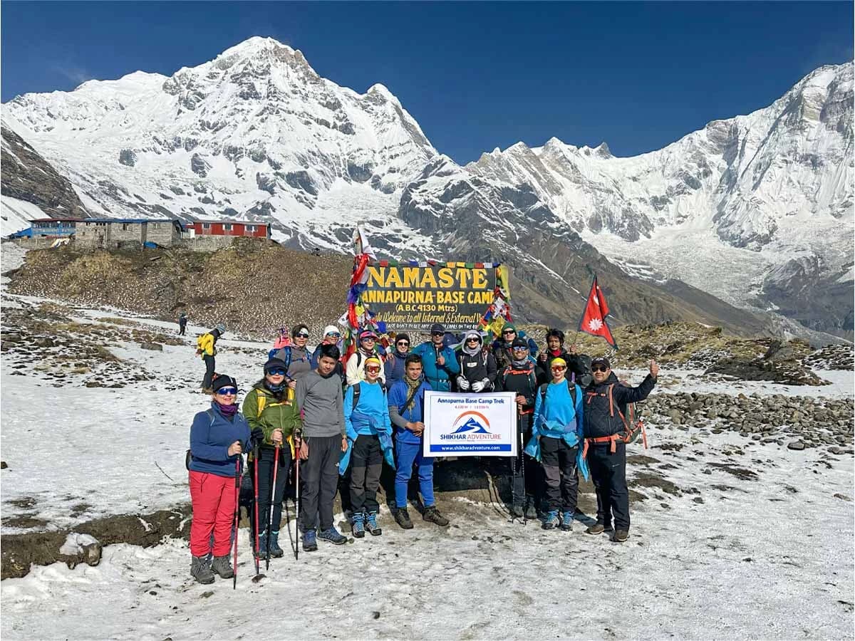 A group of trekkers from Shikhar Adventure with happy faces at Annapurna Base Camp (4,130 meter)