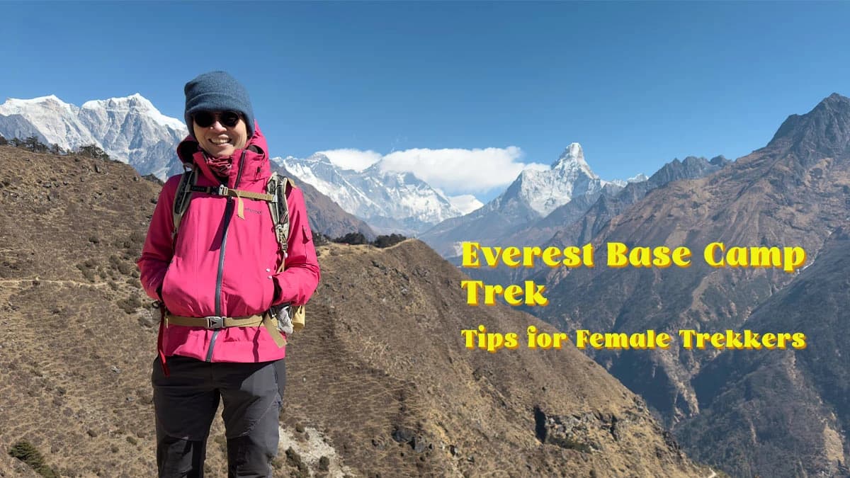 Female trekker standing on the Everest Base Camp trail.