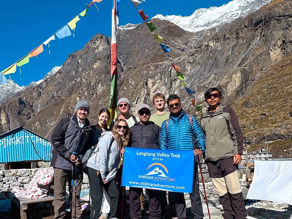 Trekkers in Langtang Valley with Shikhar Adventure amid Himalayan peaks.