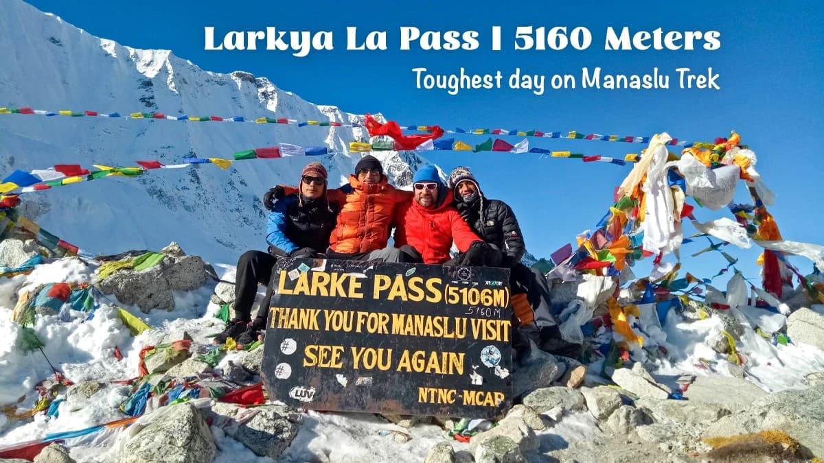 Trekkers crossing the challenging snowy trail of Larkya La Pass during the Manaslu Trek