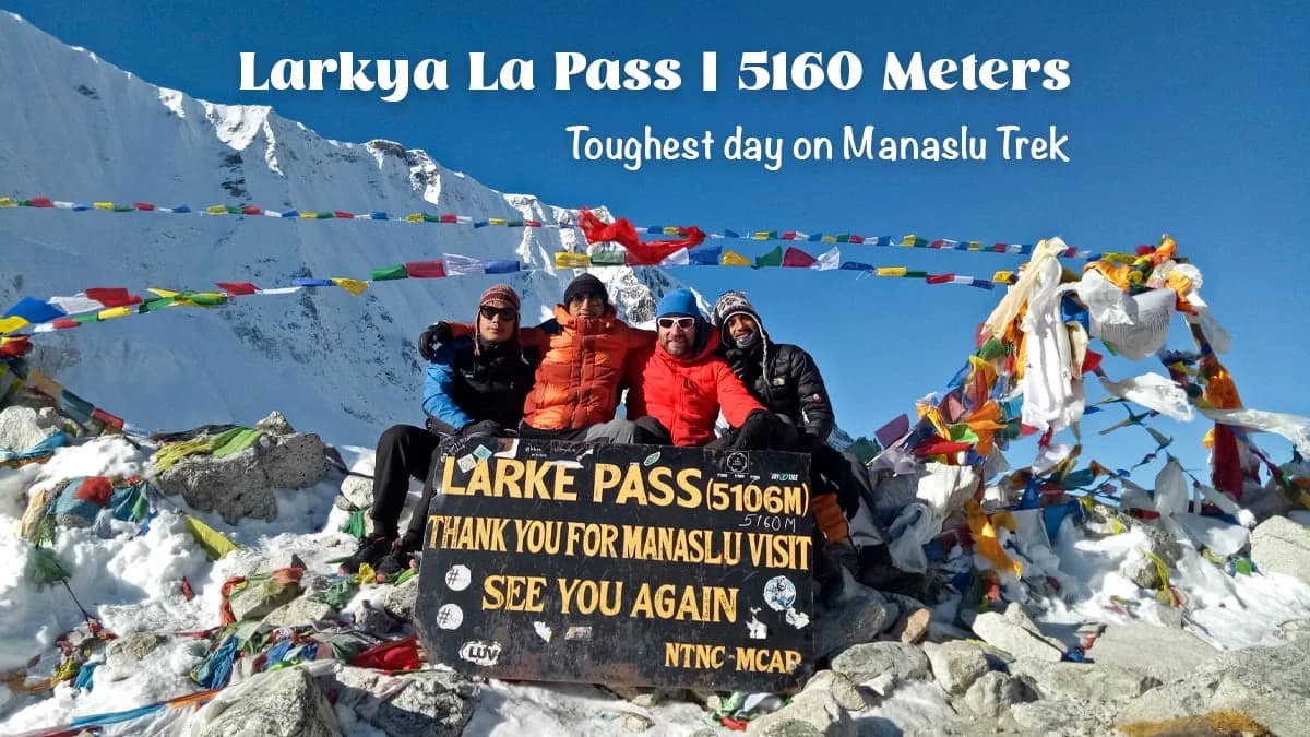 Trekkers celebrating at Larkya La Pass on the Manaslu Circuit Trek