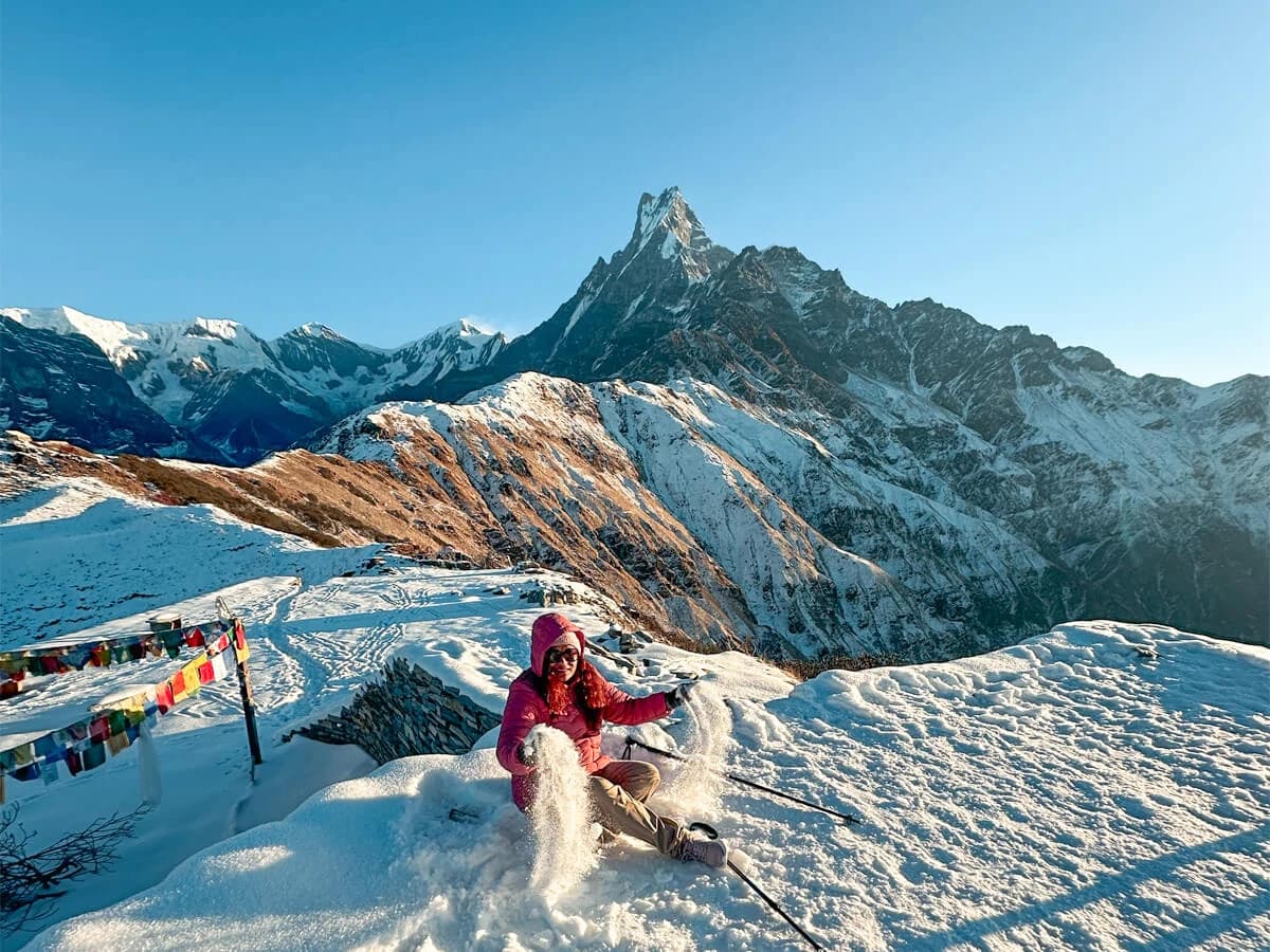 Trekker enjoying snow during Mardi Himal Trekking