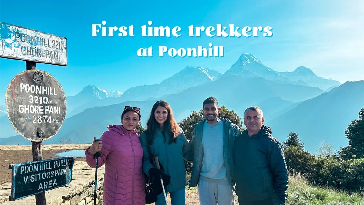 First-time trekker celebrating sunrise at Poon Hill viewpoint in Nepal with Annapurna mountains